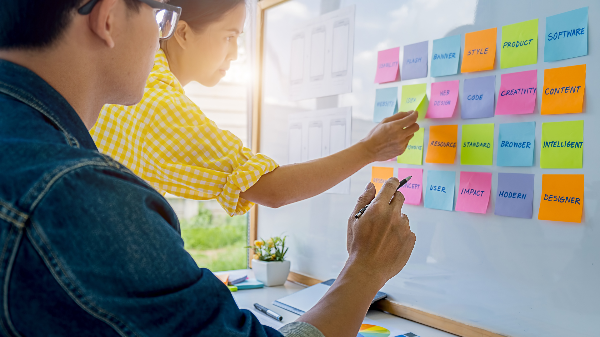 Content managers with colored stickers t manage online content.